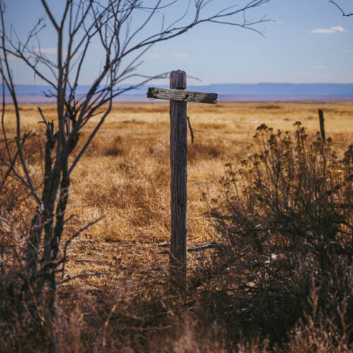 Wooden cross in an open field